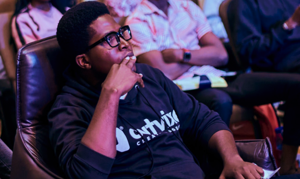 Ulu Oluebubechukwu seated during a conference session